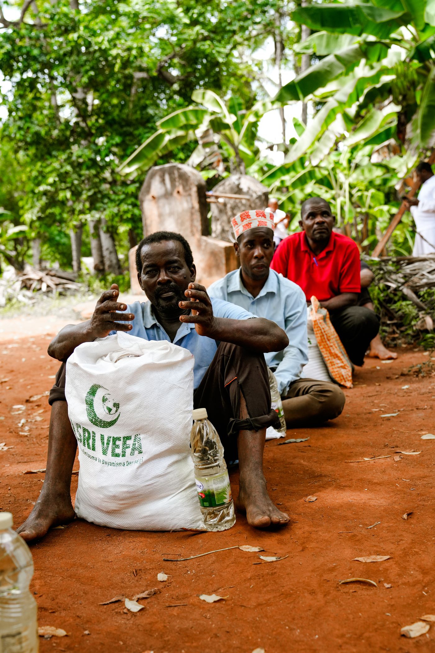 Farmers preparing agricultural supplies and equipment