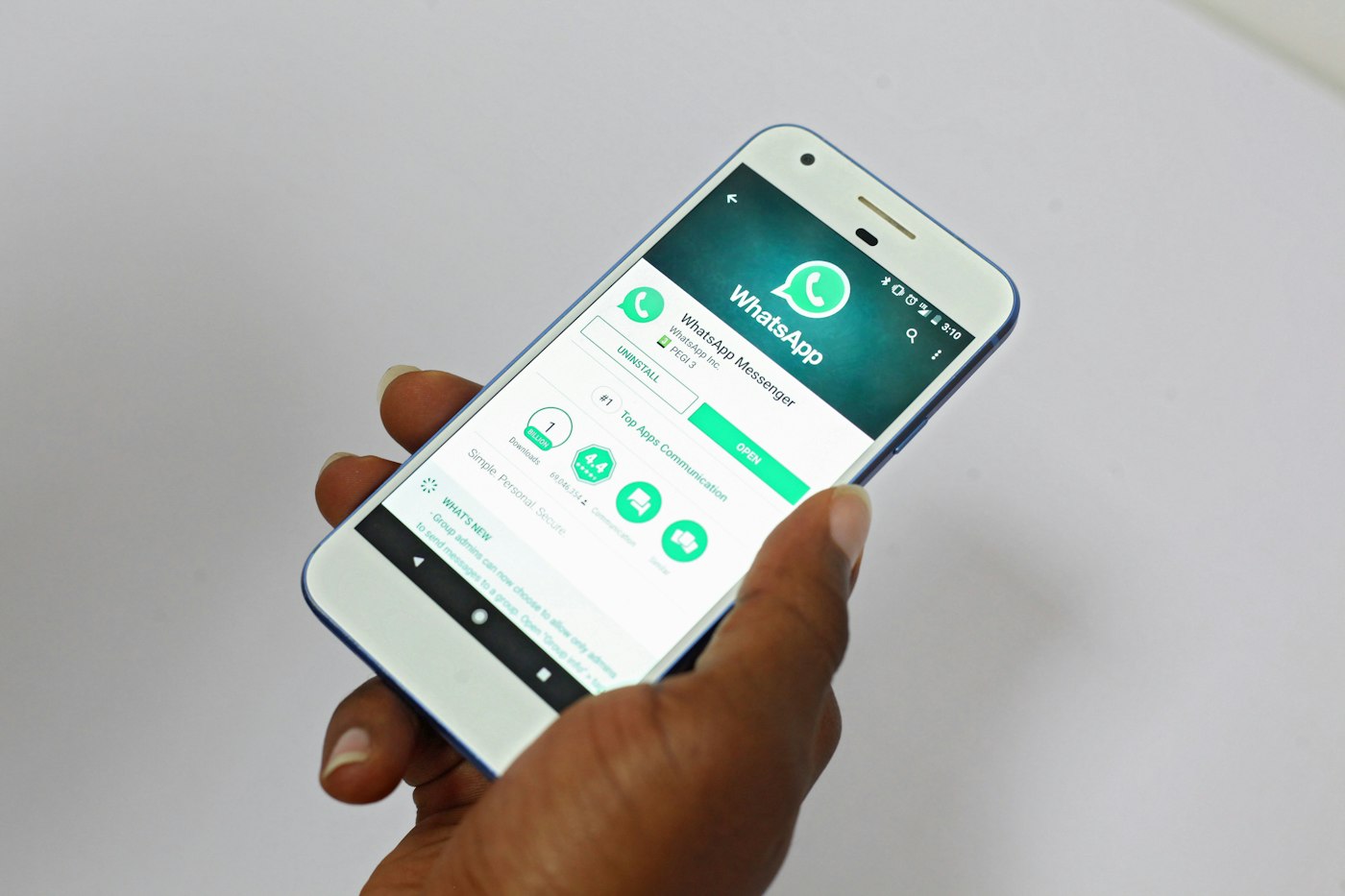 A man in Lagos using a smartphone to keep digital records